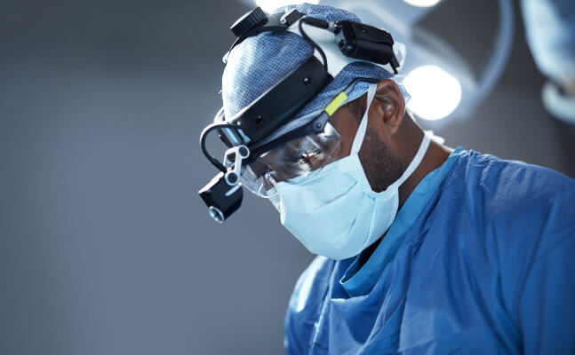 Specialist surgeon in operating theatre