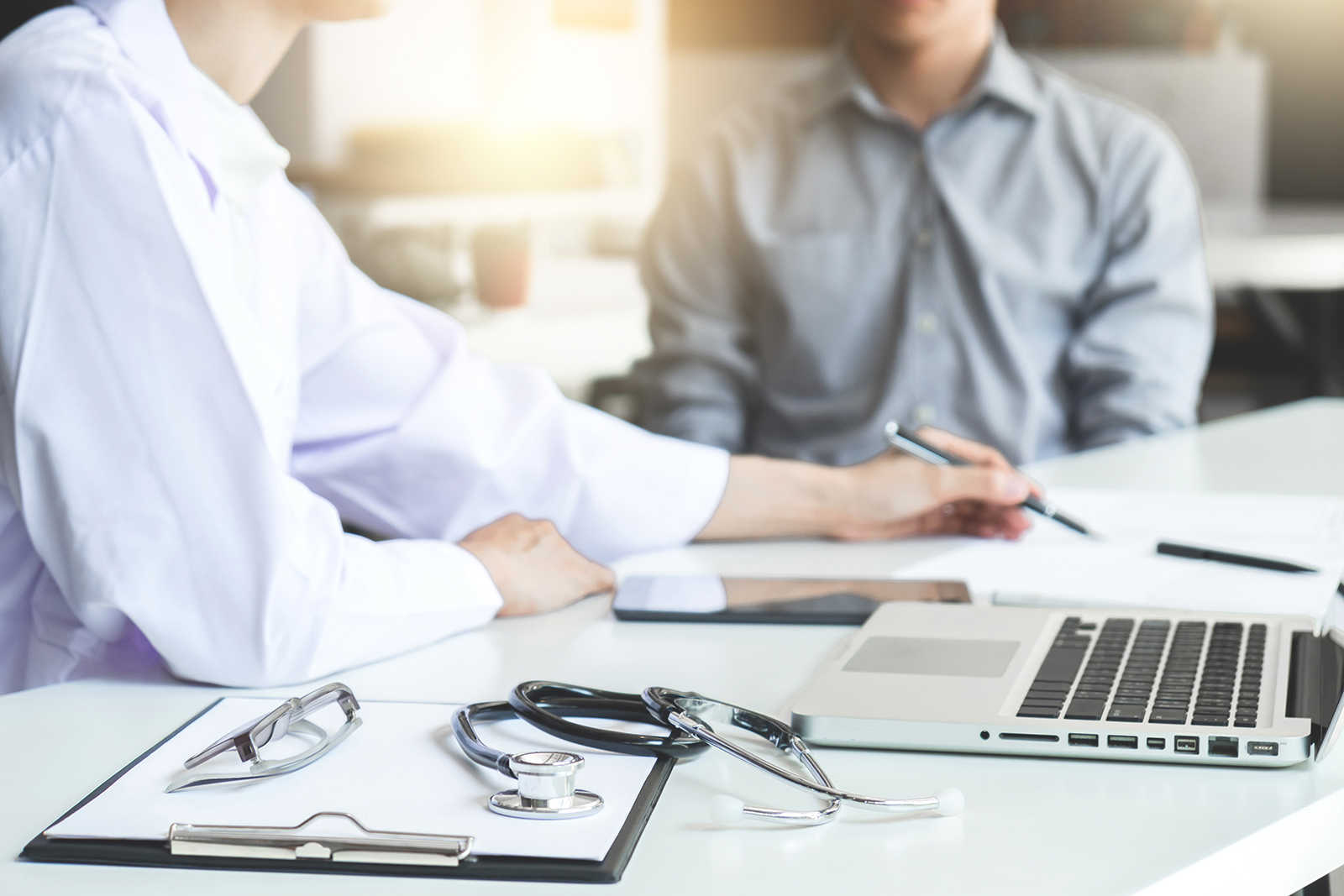 Doctor and patient reviewing documentation